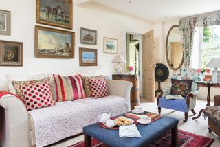 sitting room with colourful cushions and artwork