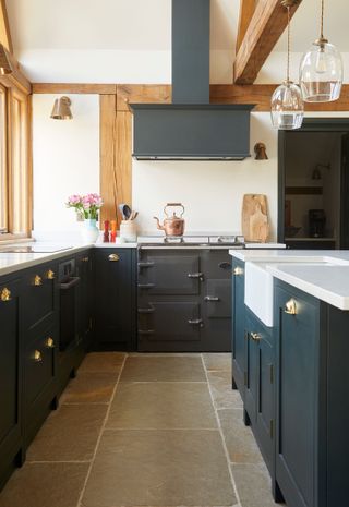 blue kitchen with white worktops