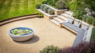 circular patio with gravel and built-in seating