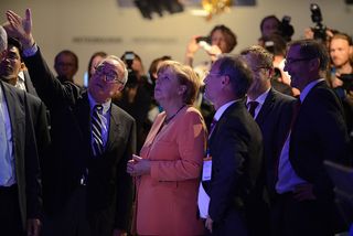 German Chancellor Angela Merkel Visits the Exhibition