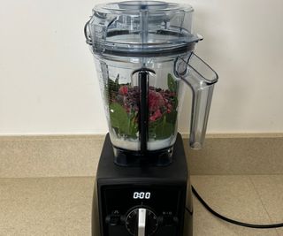 Milk, berries, spinach and protein powder in the Vitamix Ascent Series A2300 Blender