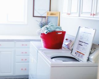 Laundry room with a top-load washer