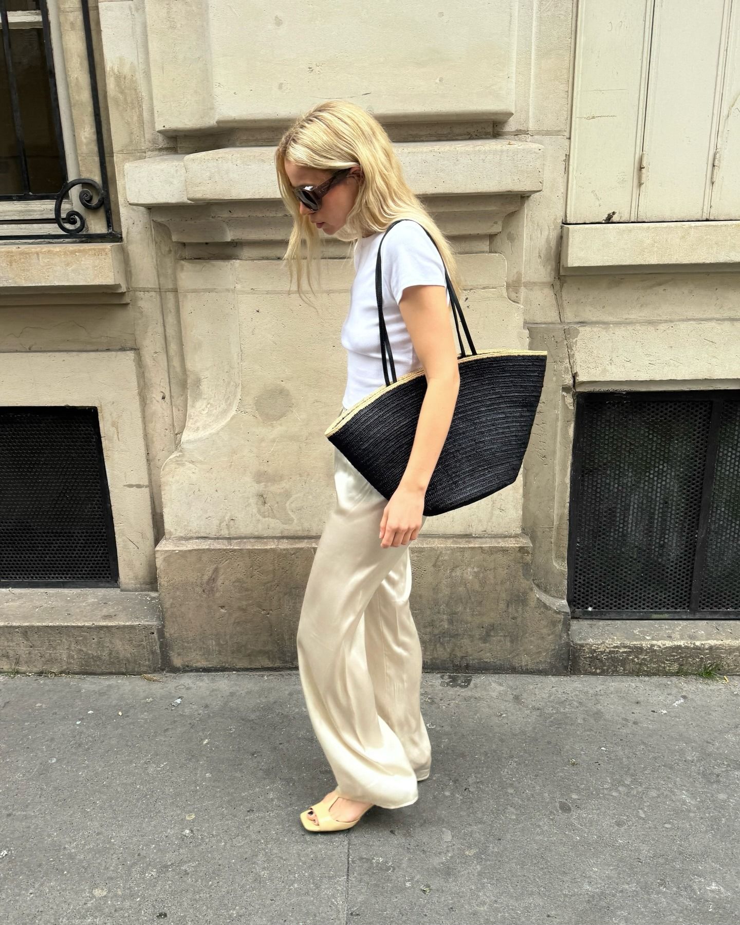 Influencer wearing spring 2026 outfit with silk pants.
