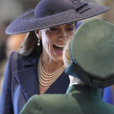 Kate Middleton wears a big blue hat and speaks with Princess Anne during the 2026 Commonwealth Day Service at Westminster Abbey on March 9, 2026 in London, England
