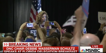 DNC Chairwoman Debbie Wasserman Schultz was booed at a delegate breakfast following her implication in trying to bring down Bernie Sanders.