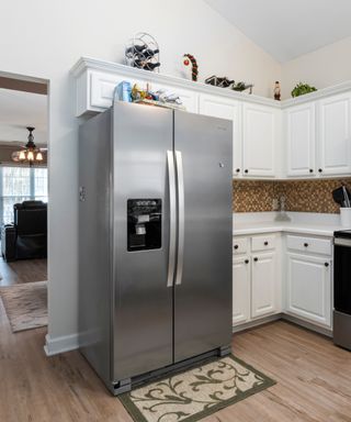 A silver fridge in a kitchen