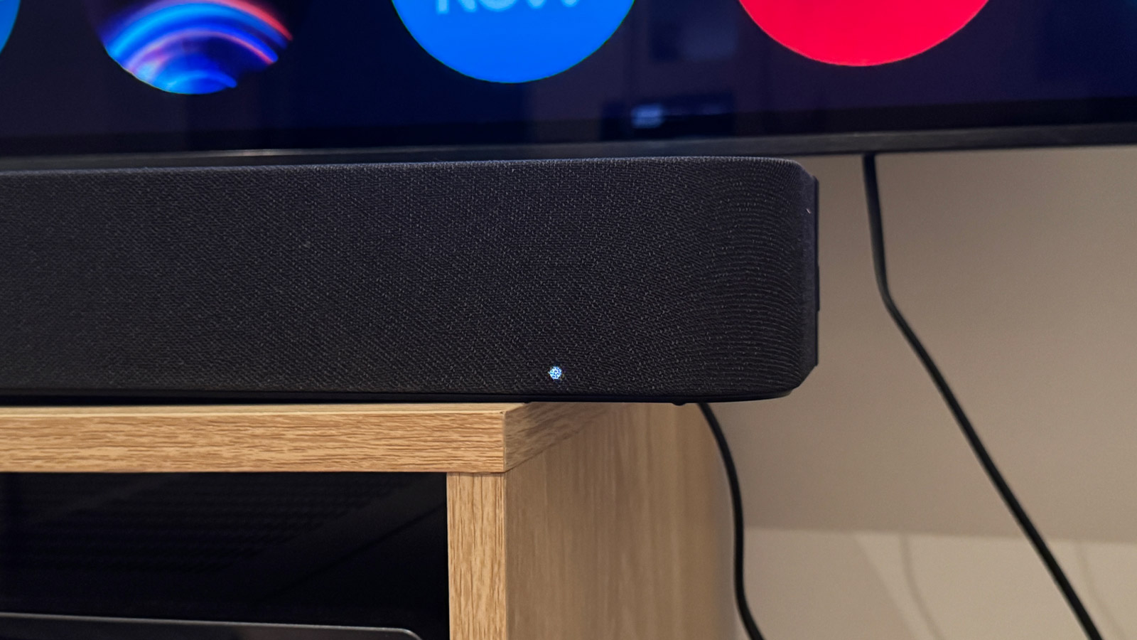 Close-up image of the front LED indicator on the Sony Bravia Theater Bar 8 soundbar.