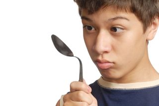 boy bends spoon with mind