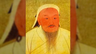 An illustration of Genghis Khan shows his face and torso. He wears a white robe and hat, has a wispy black beard and mustache and hoop earrings. The background is yellowish.