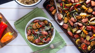 Sausage and pepper traybake on dish and in bowl