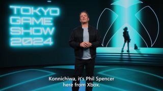 Phil Spencer in front of Tokyo Games Show 2024 logo