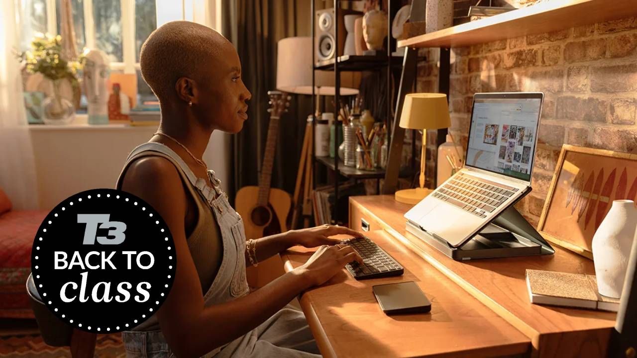 A woman using the Logitech Casa Pop Up Desk while working from home