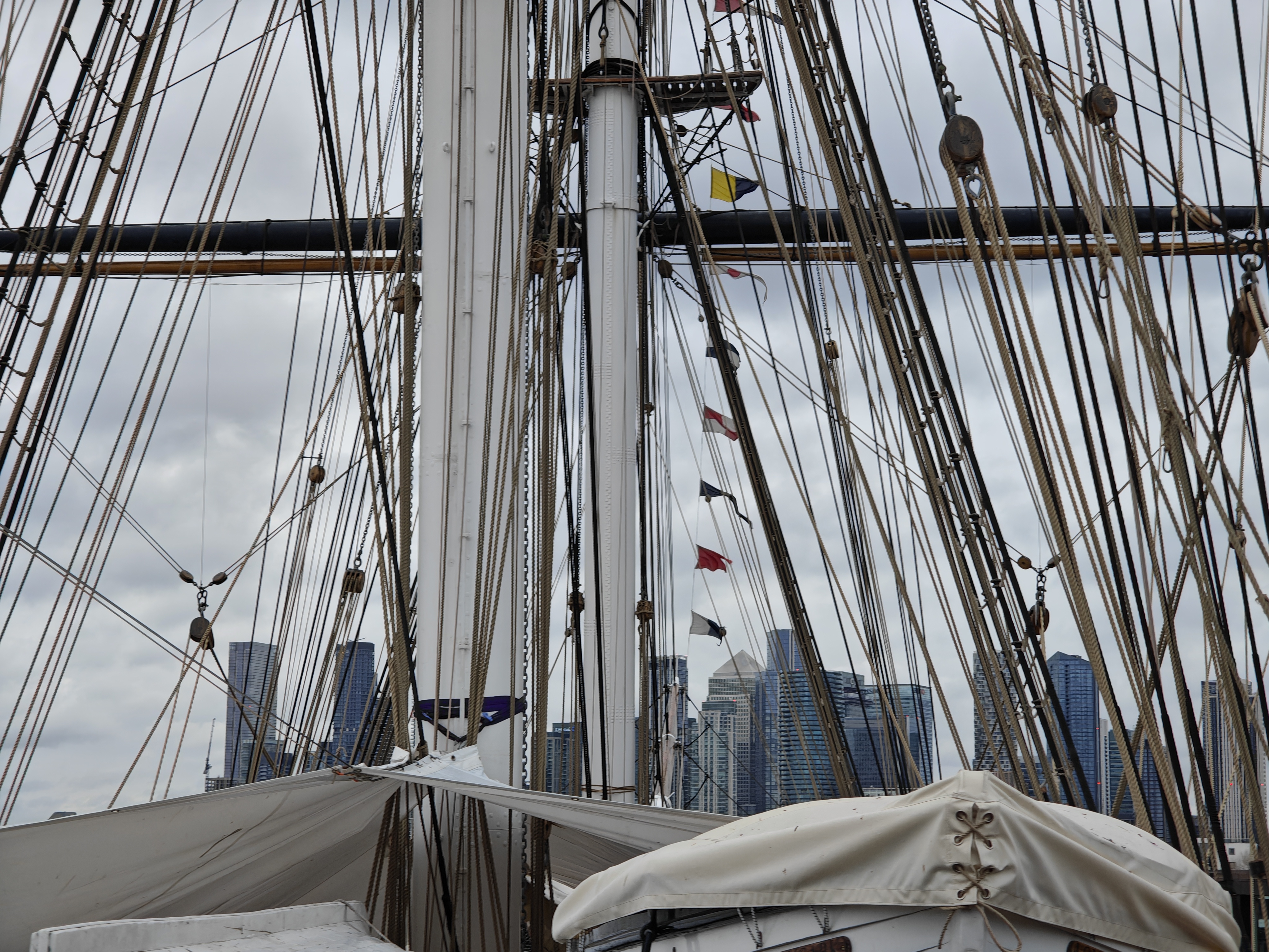 A photo of ship rigging and a city scape taken on the Nothing Phone 3.