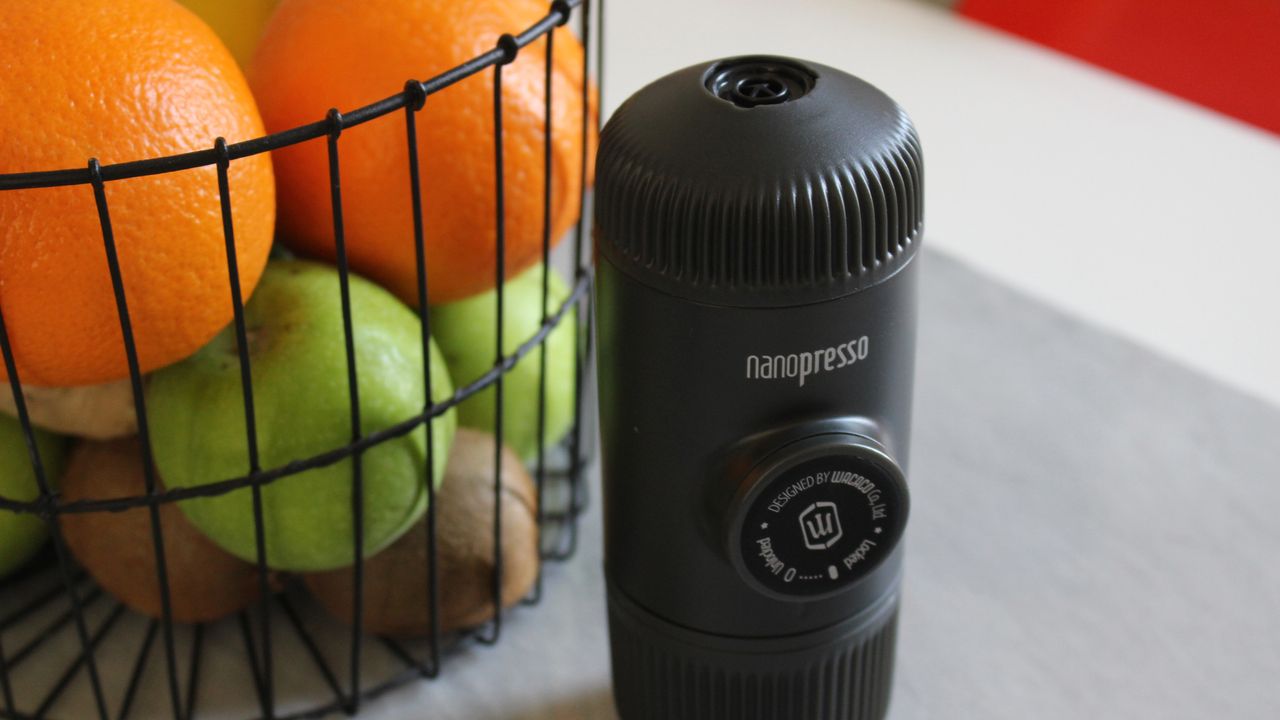 Wacaco Nanopresso beside a basket of fruit
