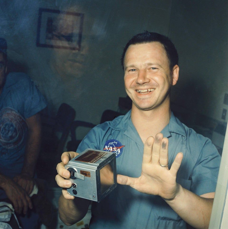 NASA photographer Terry Slezak shows off the moon dust on his fingers. 