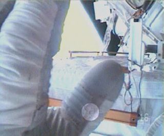 Damaged Spacesuit Glove Ends ISS Spacewalk Early