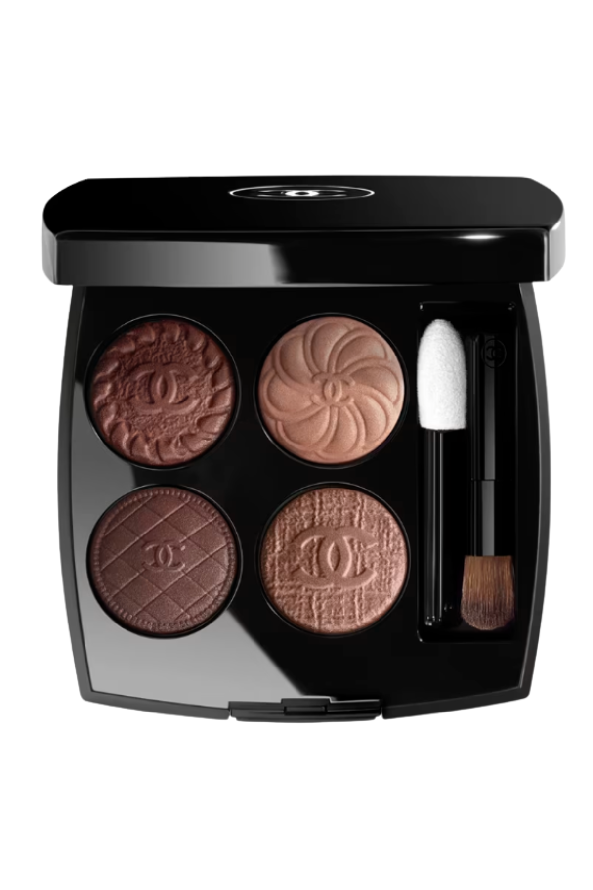 a black chanel eyeshadow compact with four bronze colors