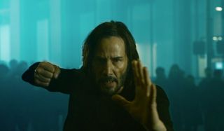 Neo readies his fists for a fight in The Matrix Resurrections.