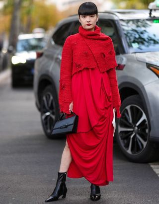 Paris fashion week street style - woman in red dress and black boots