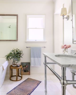 Magnolia small bathroom with plant on stool