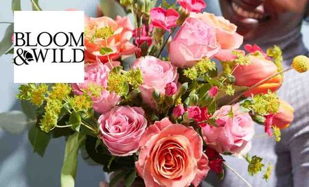 The bloom & wild logo over the image of some flowers