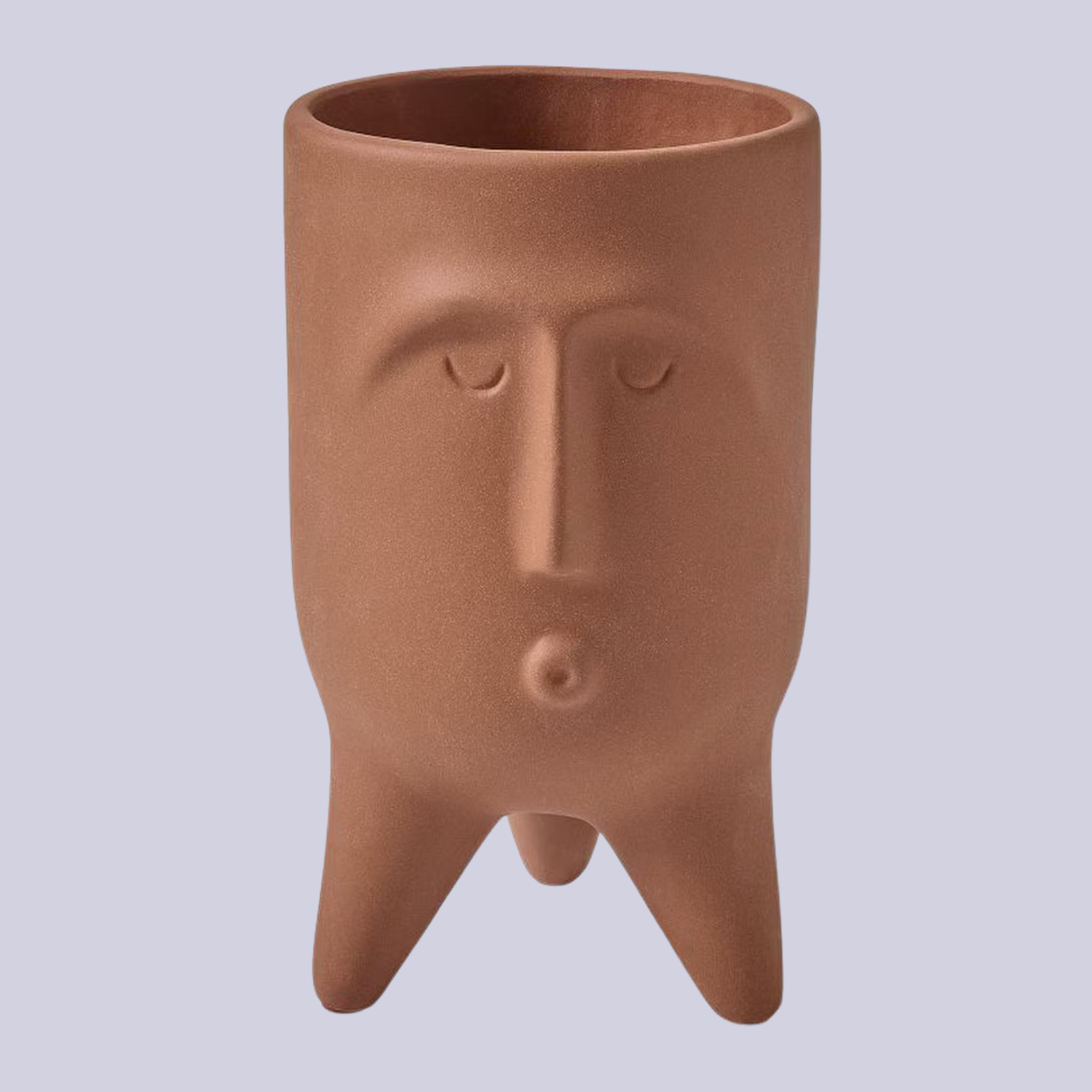 A terracotta planter with three feet