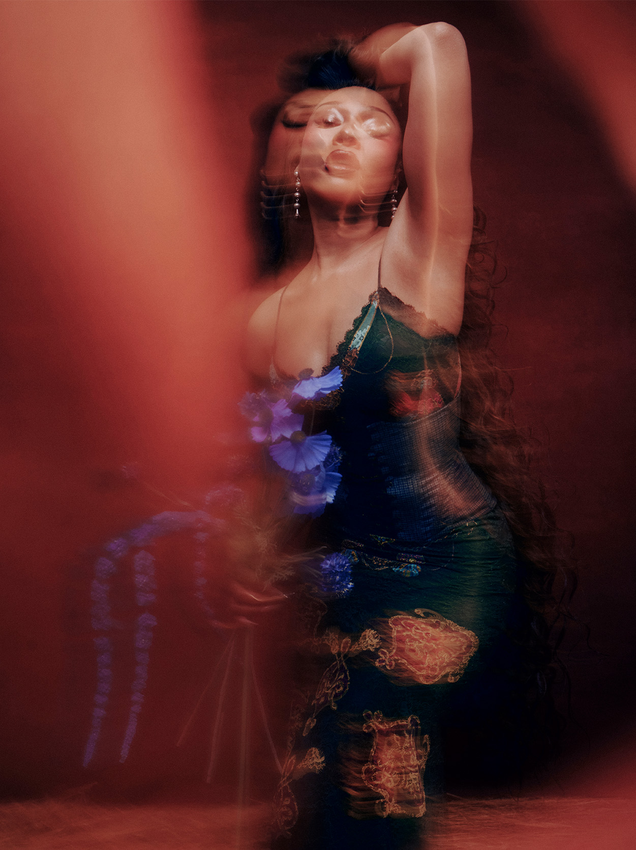 faded image of Megan Thee Stallion wearing a black dress