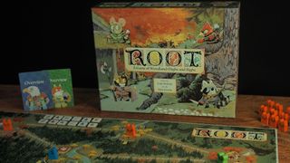 Root box, board, tokens, and cards on a wooden table