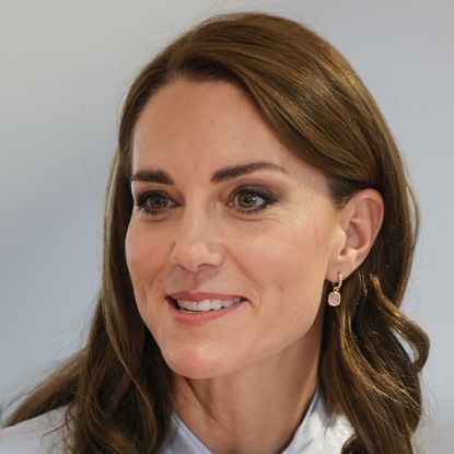 Princess Kate wearing pink drop earrings and smiling