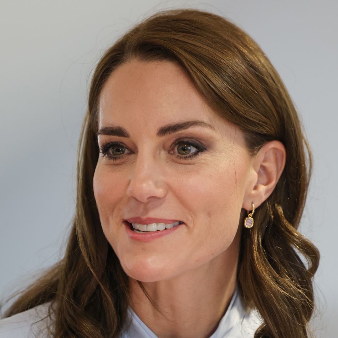 Princess Kate wearing pink drop earrings and smiling