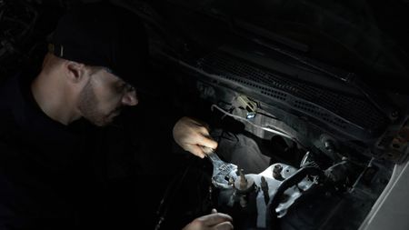 Man fixing car