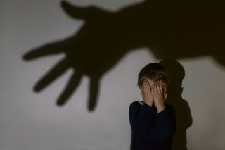 child scared with hand shadow