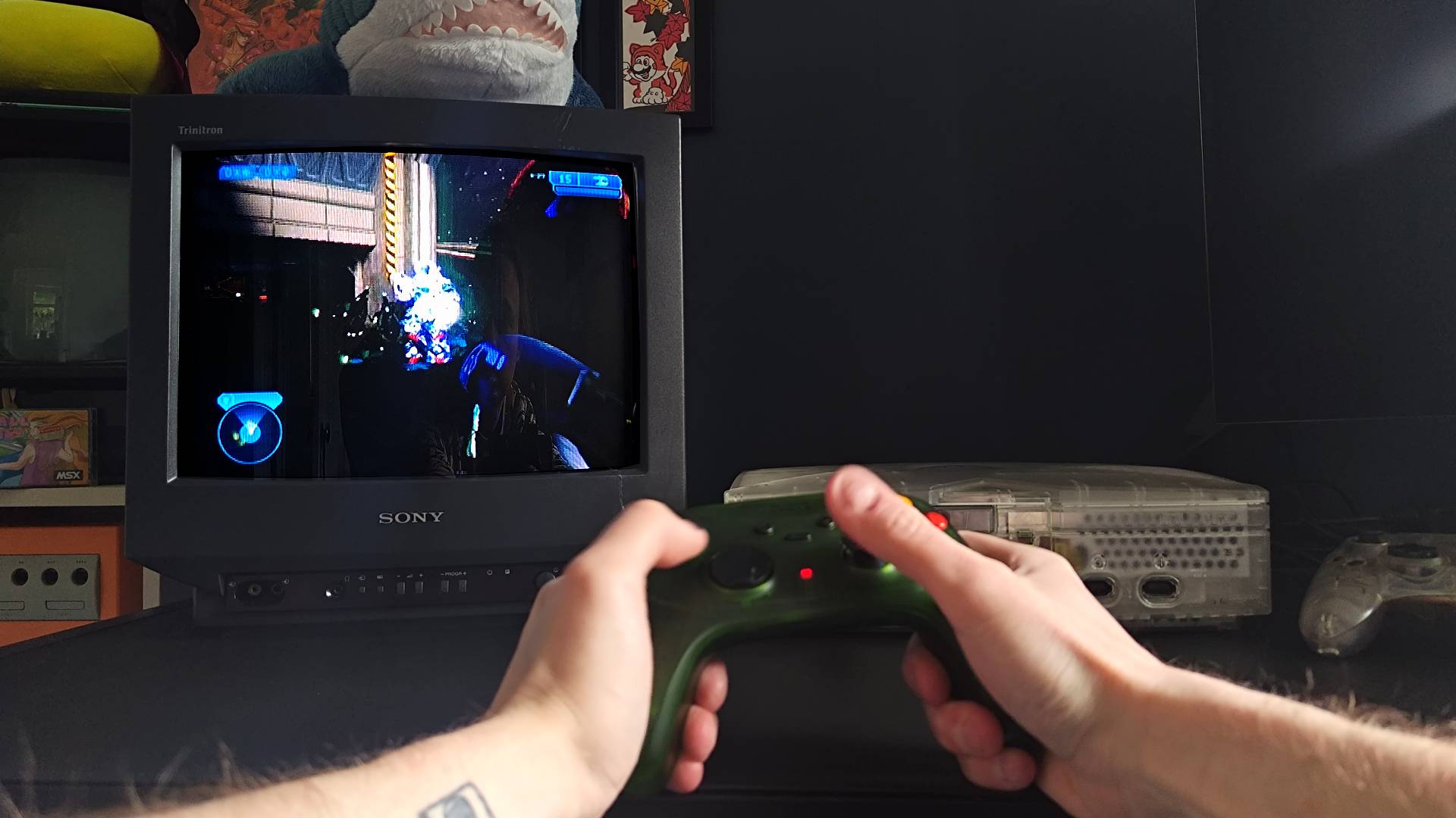 Retro Fighters Hunter being used to play Halo 2 on OG Xbox with Master Chief shooting Hunter.