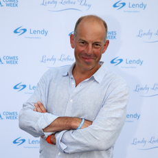 Phil Spencer wearing a blue shirt on the red carpet.
