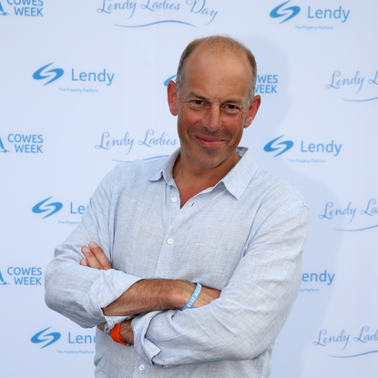 Phil Spencer wearing a blue shirt on the red carpet.