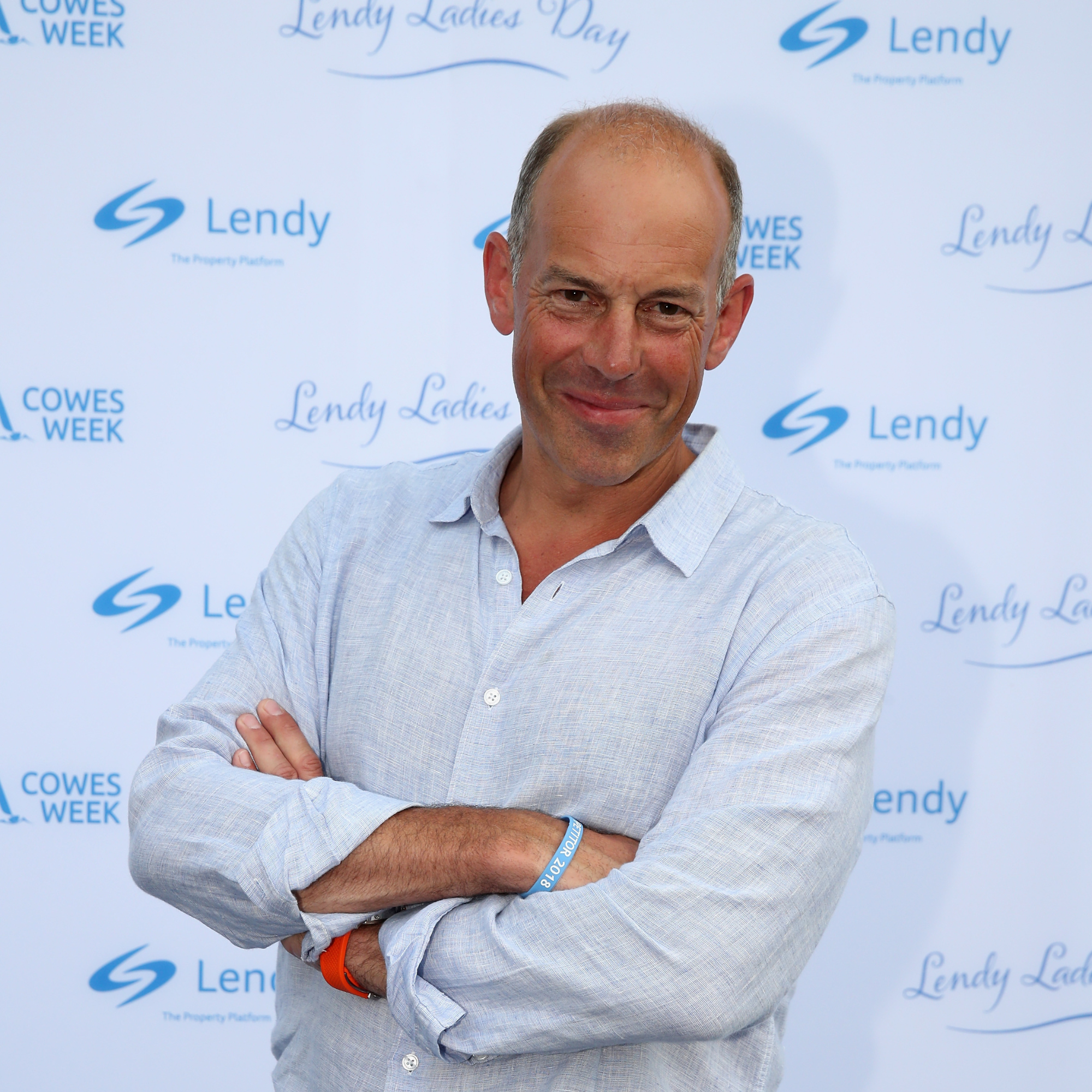 Phil Spencer wearing a blue shirt on the red carpet.