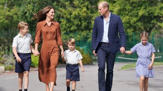 Prince George, Princess Charlotte and Prince Louis (C), accompanied by their parents the Prince William, Duke of Cambridge and Catherine, Duchess of Cambridge, arrive for a settling in afternoon at Lambrook School, near Ascot on September 7, 2022 in Bracknell, England.