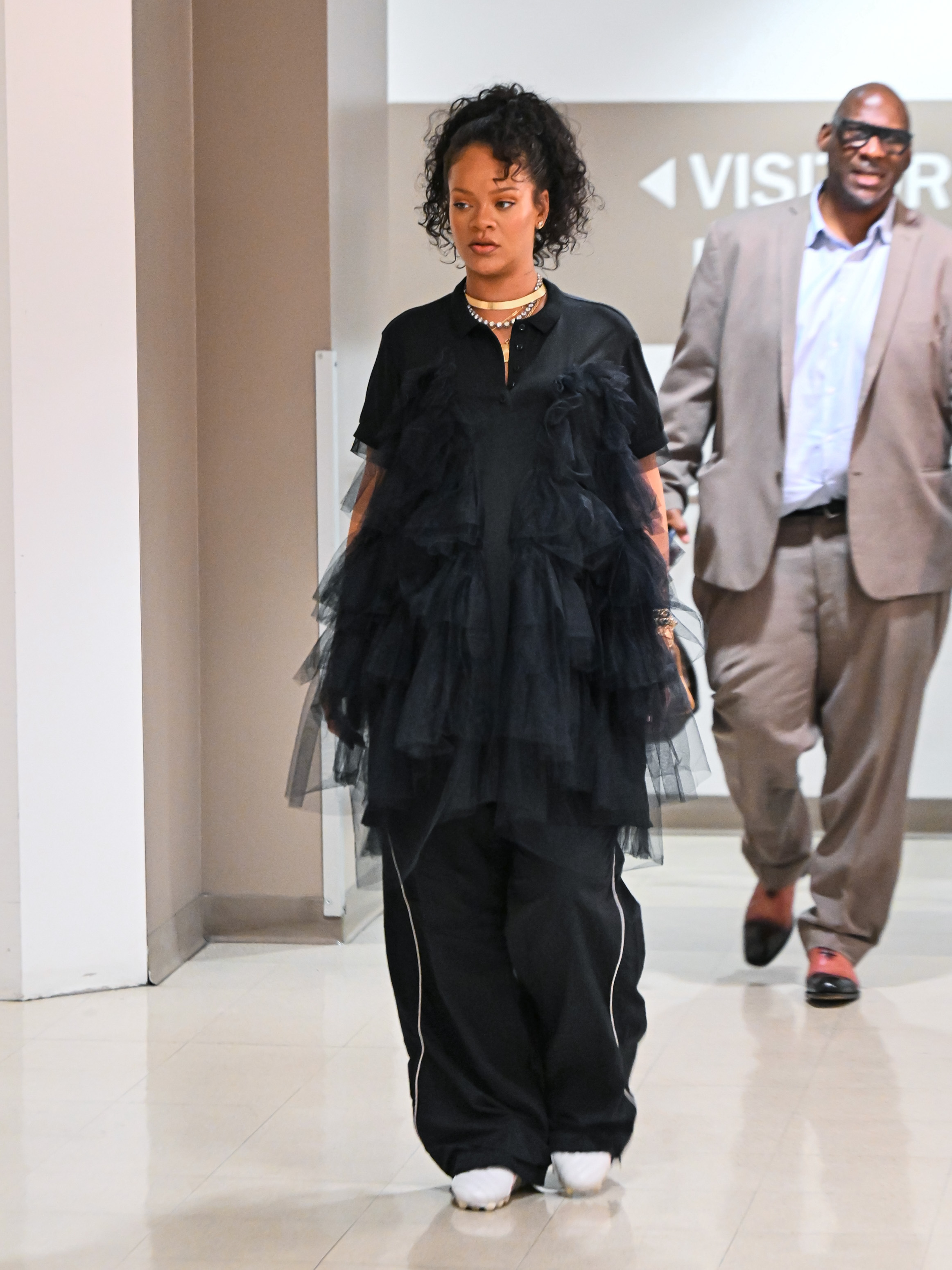 A pregnant Rihanna wore track pants with cleated sneakers
