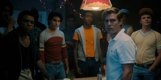 Mason Dye as Jason Carver, surrounded by other jocks, in STRANGER THINGS
