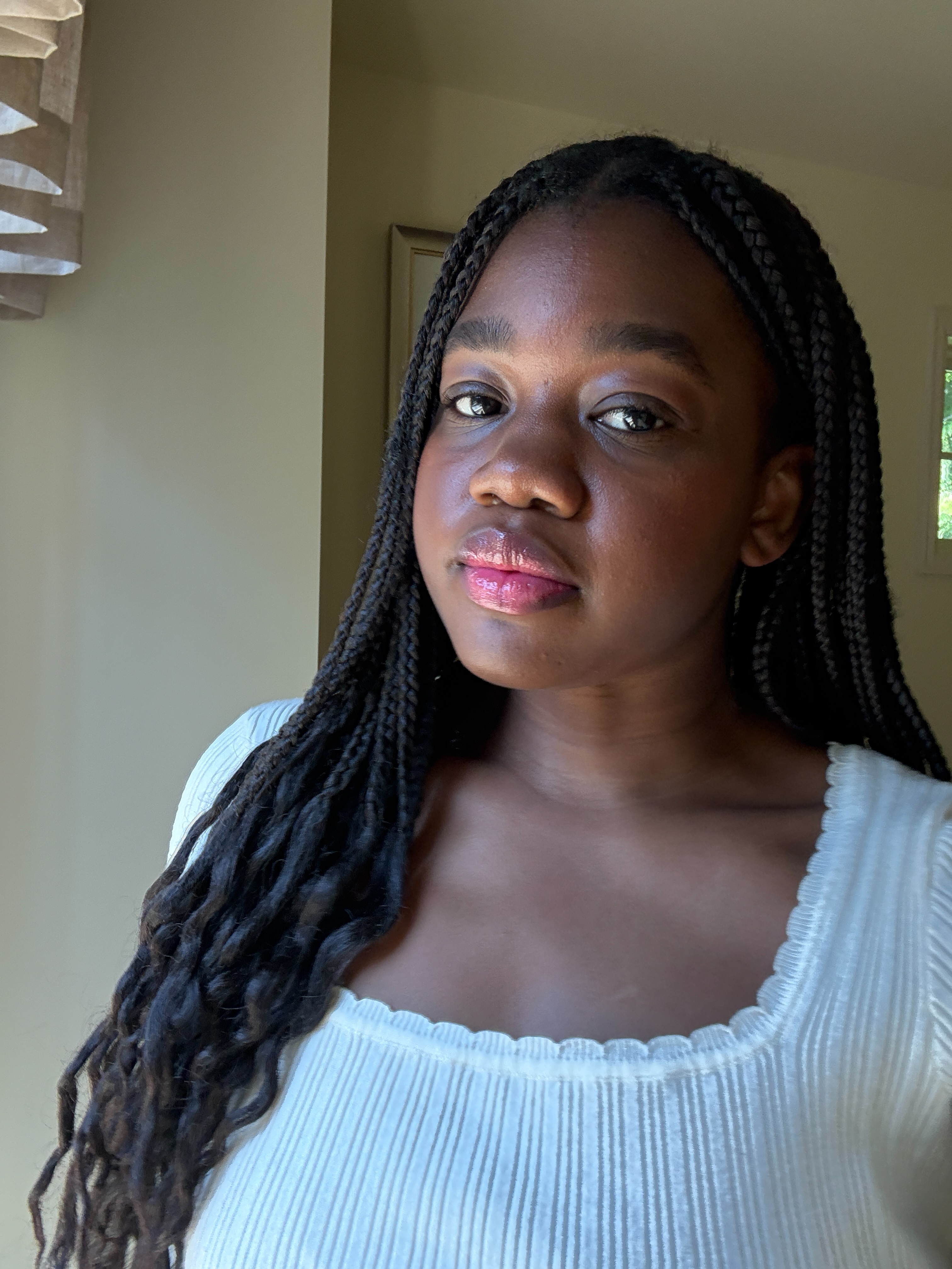 Associate Beauty Editor Maya Thomas after applying the Caudalie Vinoperfect Dark Circle Brightening Cream