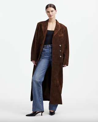 a model in front of a plain backdrop wearing an alexa chung for madewell coat