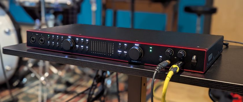 A Focusrite Scarlett 18i20 4th Gen on a table in a recording studio