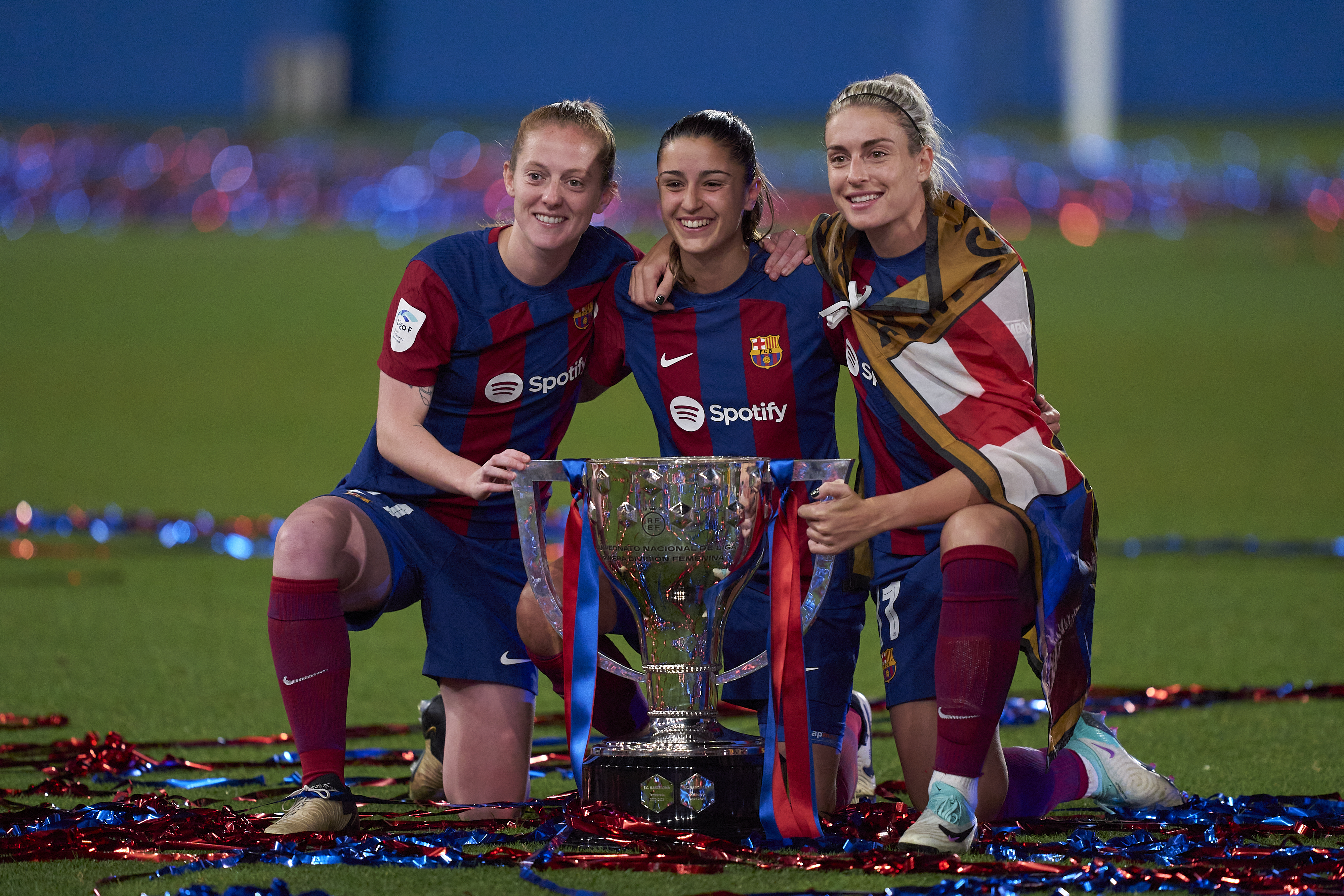 Keira Walsh, Jana Fernandez and Alexia Putellas of FC Barcelona pose for a photo with the LigaF Trophy at Estadi Johan Cruyff on May 10, 2024