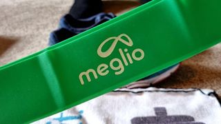 Image shows closeup of a green Meglio Latex Free Resistance Band.