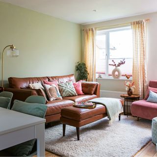 light green living room with leather sofa