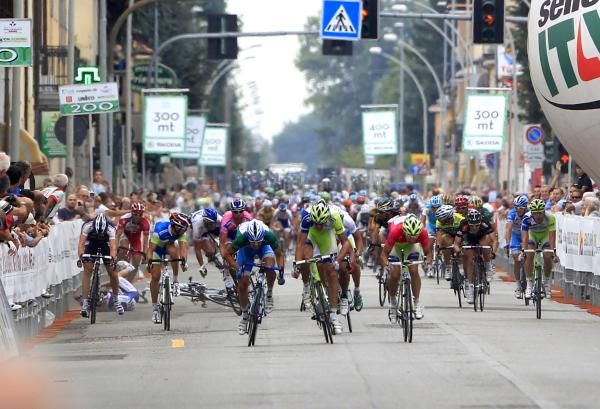 A crash marred the finishing sprint, on a day when protesters again interrupted the racing.