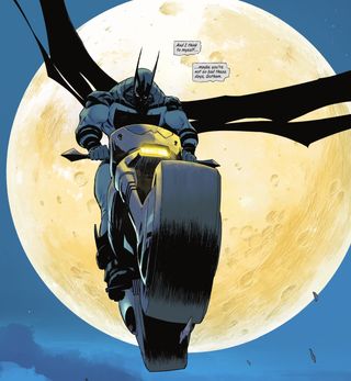 Batman rides a motorbike in front of the moon.