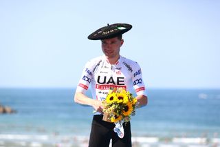 SAN SEBASTIAN SPAIN AUGUST 10 Marc Hirschi of Switzerland and UAE Team Emirates celebrates at podium as race winner with the Txapela hat Trophy during the 44th Donostia San Sebastian Klasikoa 2024 a 236km one day race from San Sebastian to San Sebastian UCIWT on August 10 2024 in San Sebastian Spain Photo by Gonzalo Arroyo MorenoGetty Images