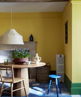 dining space with yellow wall