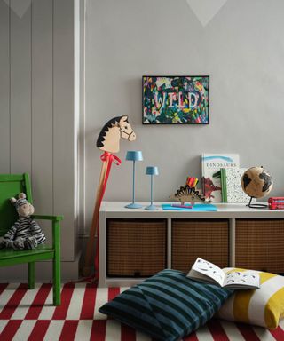 child's room with low level storage and wicker baskets